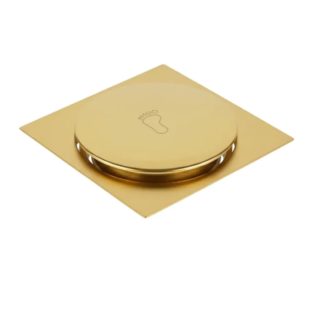 Desagüe cuadrado push button de piso 4'' dorado satinado en acero inox para tubo 3'', Hidrotek.